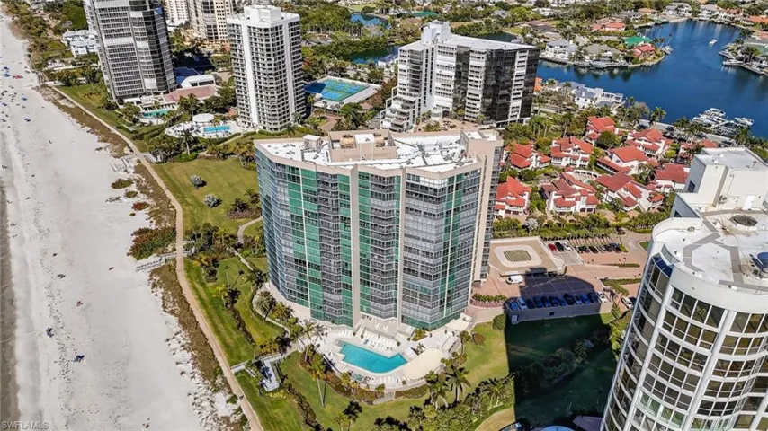 View of urban area featuring a large body of water and a pool area
