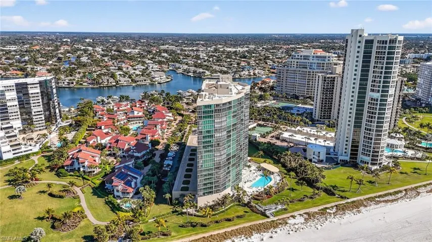 Aerial view of property's location with a large body of water and nearby urban area