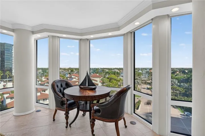 Sunroom / solarium featuring plenty of natural light, tile patterned flooring, crown molding, and recessed lighting