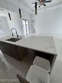 Isla with built-in space for trash bins.