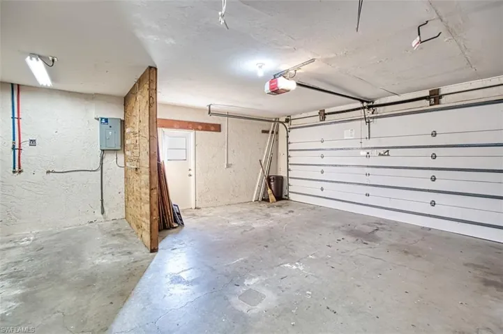 Two car garage with side service door and auto garage door opener