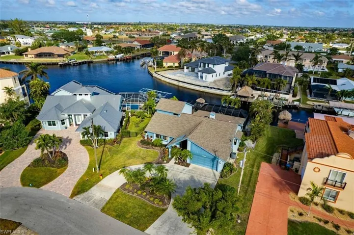View of intersecting Canals with DIRECT Gulf Access, large dock with tiki bar and 10k Boat Lift