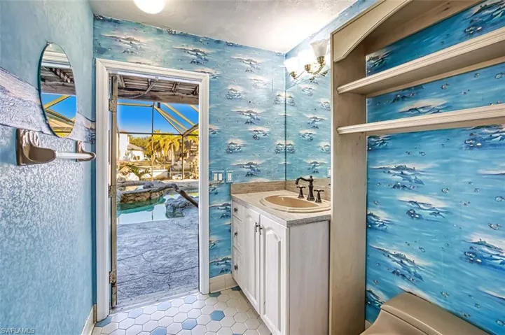Guest Bath serves as a Pool bath and opens onto the lanai