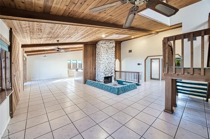 Tiled floor, vaulted cedar ceilings and wood accents throughout