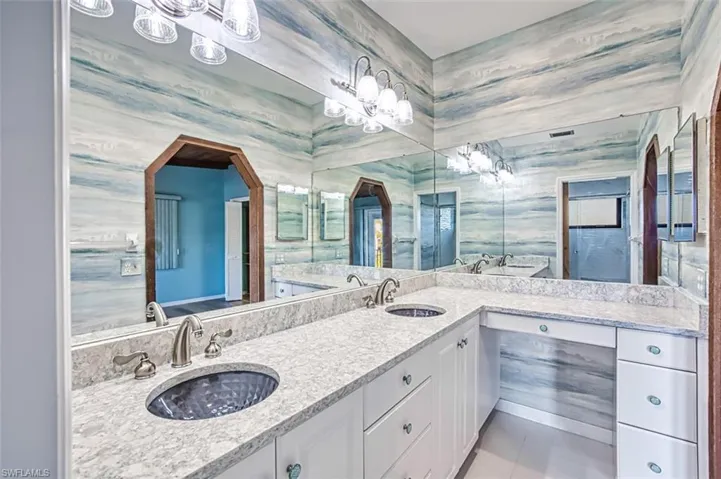 Primary Bath with Granite countertops, dual sinks and county Vanity area