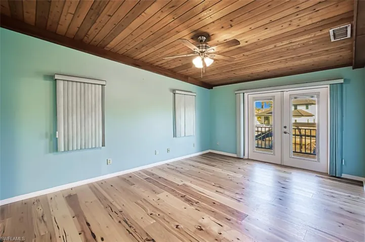 Primary Bedroom has double doors (w/built in blinds) to open Balcony and beautiful views