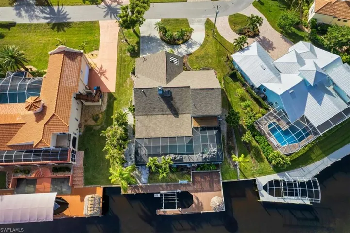 Rear aerial view of home-Large boat deck/dock with tiki bar and 10k Boat Lift