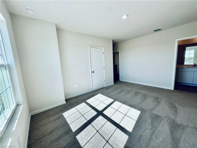 Empty room with carpet flooring