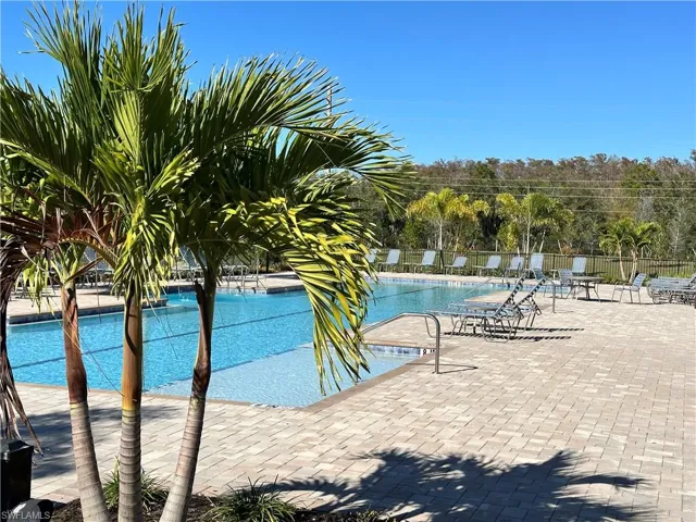 Community pool with a patio area