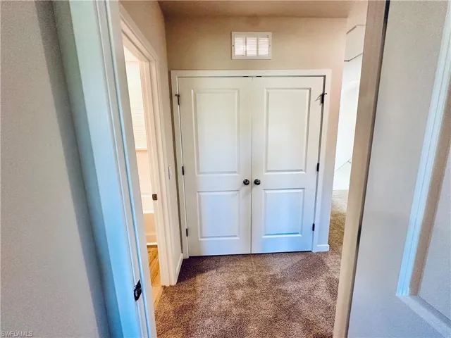 Corridor with dark carpet