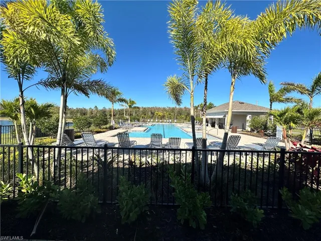 Community pool featuring a patio