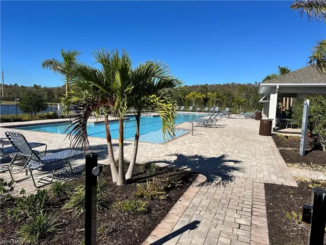 Community pool with a patio area