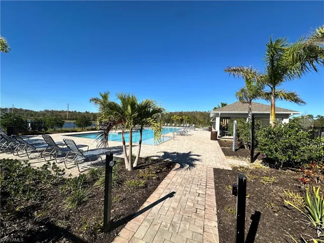 Community pool featuring a patio