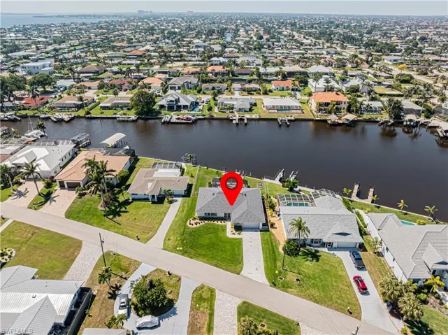Aerial perspective of suburban area with a large body of water