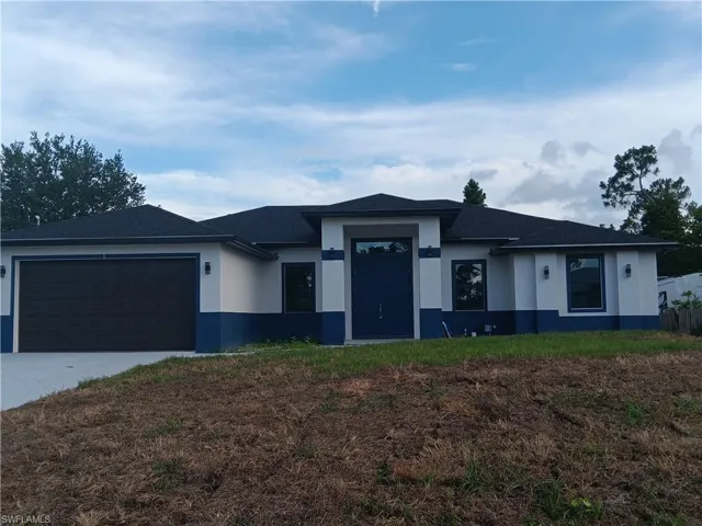 View of front of home with a garage