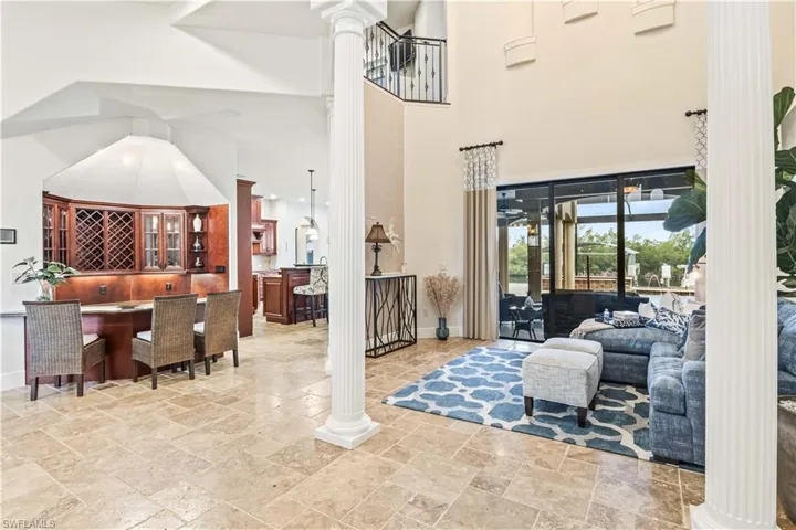 Entertain your guests with wine tasting or simply gathering around your own bar with beverage fridge, lots of storage and plenty of room.  Secret (not so much anymore) storage room on the side that will easily accommodate golf clubs, safe room, storage etc.