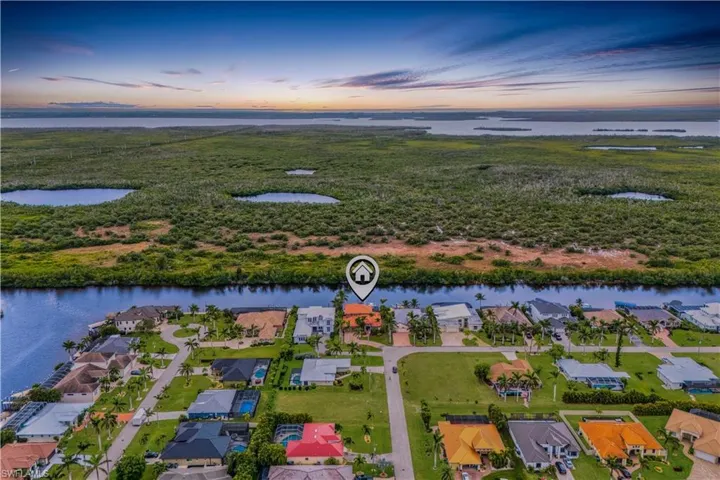 Located at the end of the street with quick and easy access to the waters and a private lot with beautiful and mature landscaping!  Sands Estates is a small enclave of beautiful homes nestled around some of the best walking areas in Cape Coral and with easy access to restaurants and shopping.