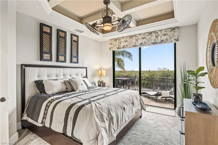 Guest bedroom # 3 - beautiful ceiling details, a double slider to the outdoor balcony with sunning ledge and a spiral staircase that offers a full 360 degree view of gorgeous Cape Coral and the waterways including the river and the gulf!