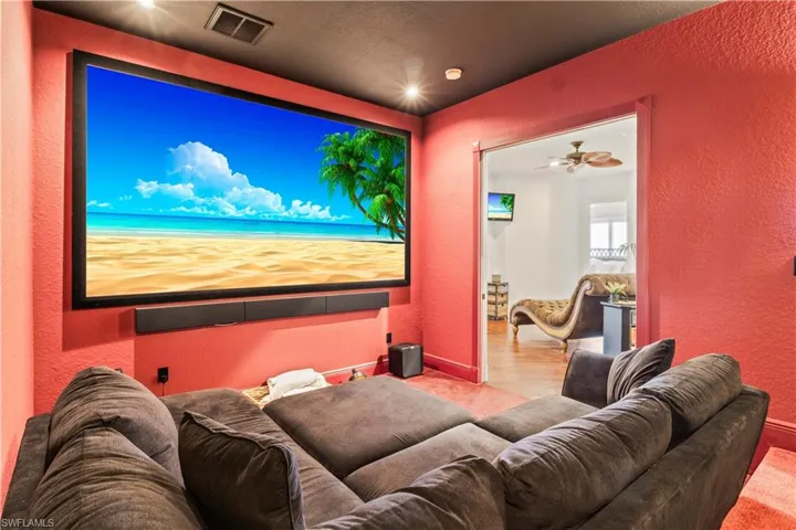 Why leave the house?  Movie and game theater right in your own home!  Sound absorbing wood flooring, surround sound, blackout blinds - a perfect place to watch movies, sports or play video games!  There is a large couch and row of lounger chairs (cannot see in this photo).  Easily accommodates ten plus people!