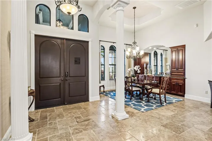 Double door entry with three transom windows WELCOMES you into this light and bright home with tall ceilings and a beautiful neutral color palette!