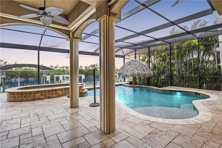 Pool and water view from the outdoor dining area!  Stuccoed ceilings, oversized pool and spa and just a dream!