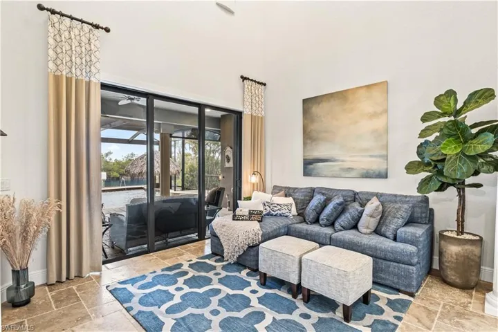 Relax in your living room with soaring two story cathedral ceilings, triple 10 foot sliders and filled with light throughout!