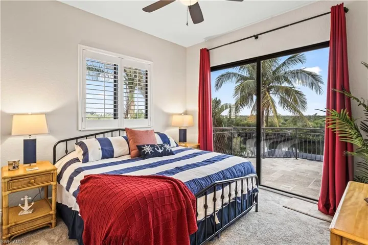 Guest bedroom # 1 with ten foot sliders, access to the large outdoor balcony and those endless sunset views over the preserve!