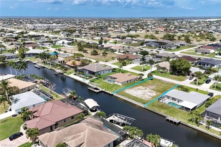 Aerial view of residential area with a nearby body of water