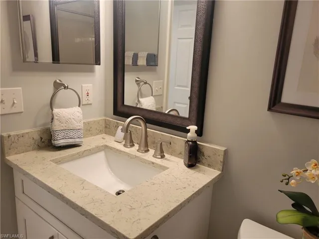 Guest bath with updated vanity, sink and faucts