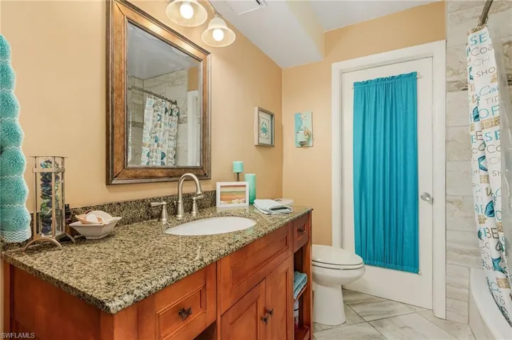 This bathroom door leads to the outside.