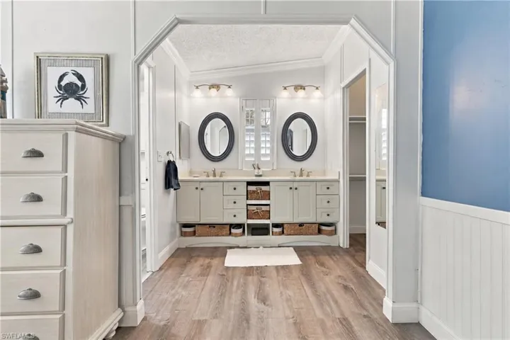 Main bath vanity with wicker baskets