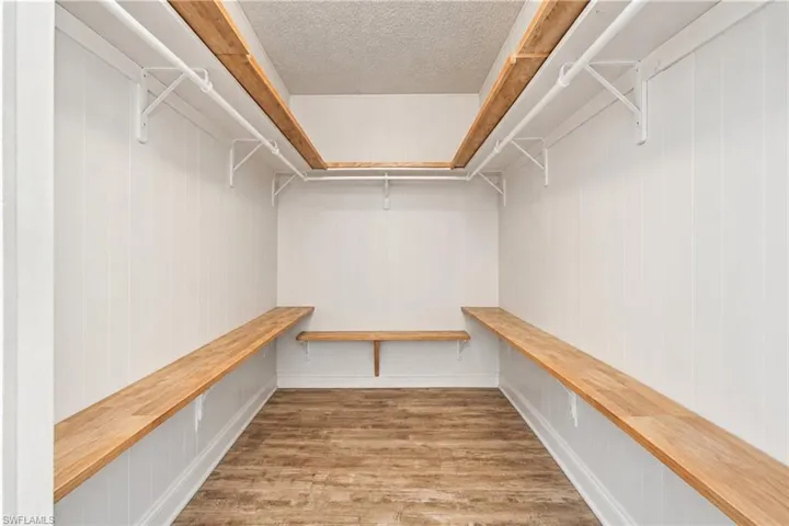 Walk in closet in main bedroom suite.
