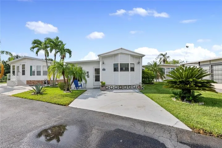 Ranch-style home with a front yard
