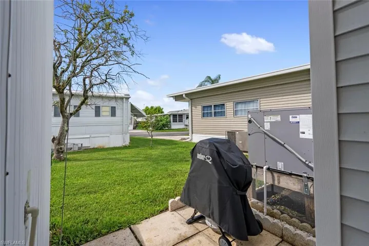 View of yard with gas grill