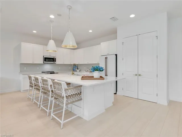 Gourmet Kitchen with GE Cafe' Matte White Appliances