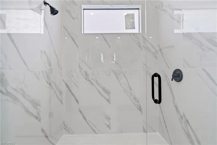 Interior details featuring an enclosed shower