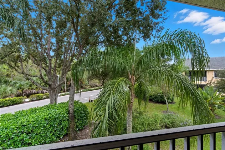 View of yard featuring a balcony