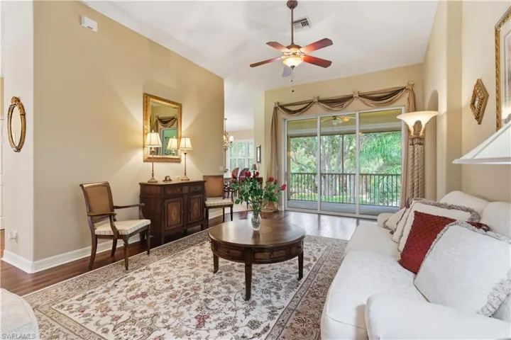 Living area featuring wood finished floors and a ceiling fan
