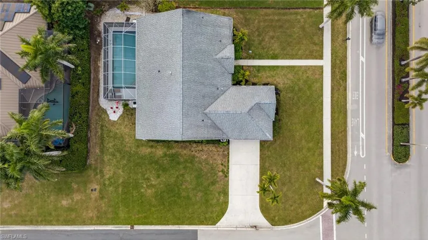 Aerial view of property and surrounding area with a pool area