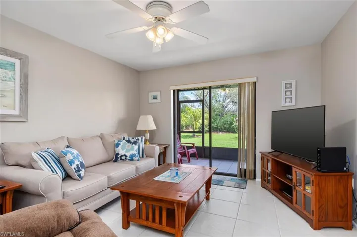 Tiled living room with ceiling fan