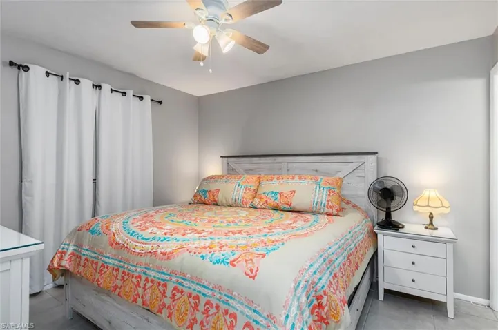 Tiled bedroom with ceiling fan