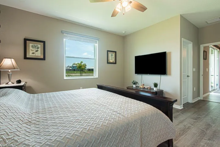 Bedroom featuring ceiling fan and wood finished floors