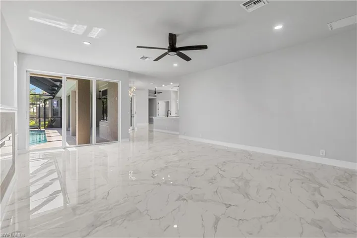 Tiled empty room with ceiling fan