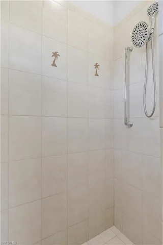 Bathroom featuring tiled shower