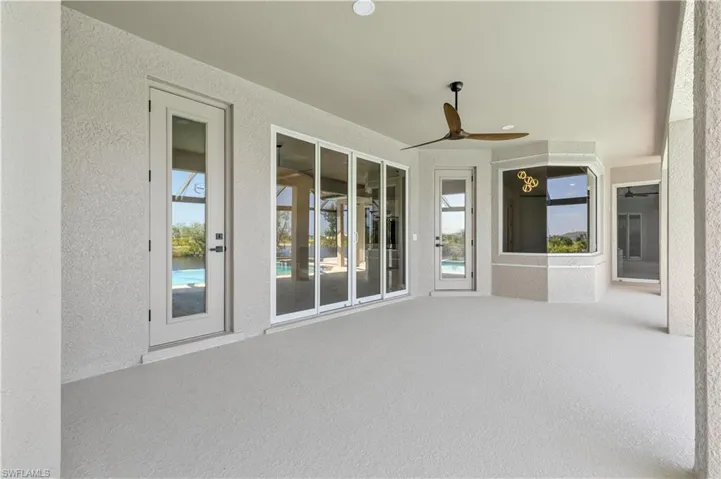 View of patio featuring ceiling fan