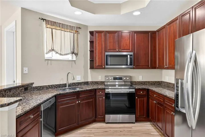 42" wood cabinets and stainless steel appliances