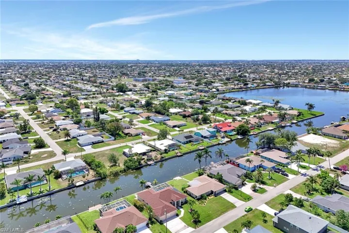 View of property location featuring nearby suburban area and a large body of water
