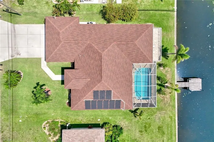 View from above of property with a nearby body of water