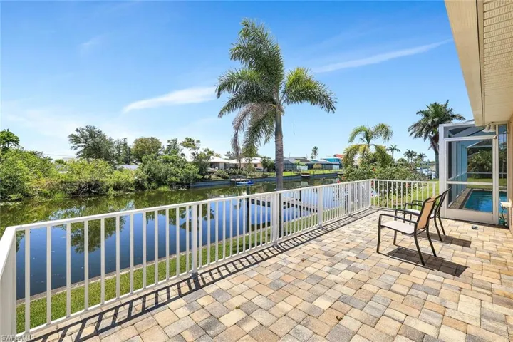 View of patio / terrace with a water view and a balcony