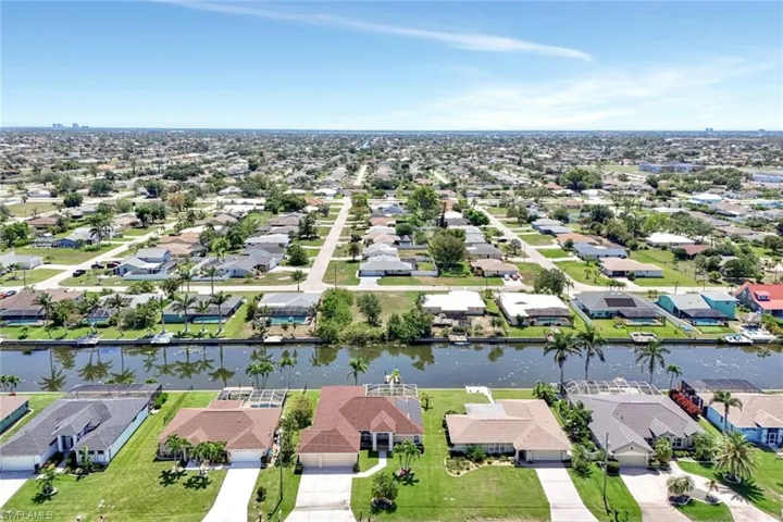 Aerial view of residential area with a nearby body of water